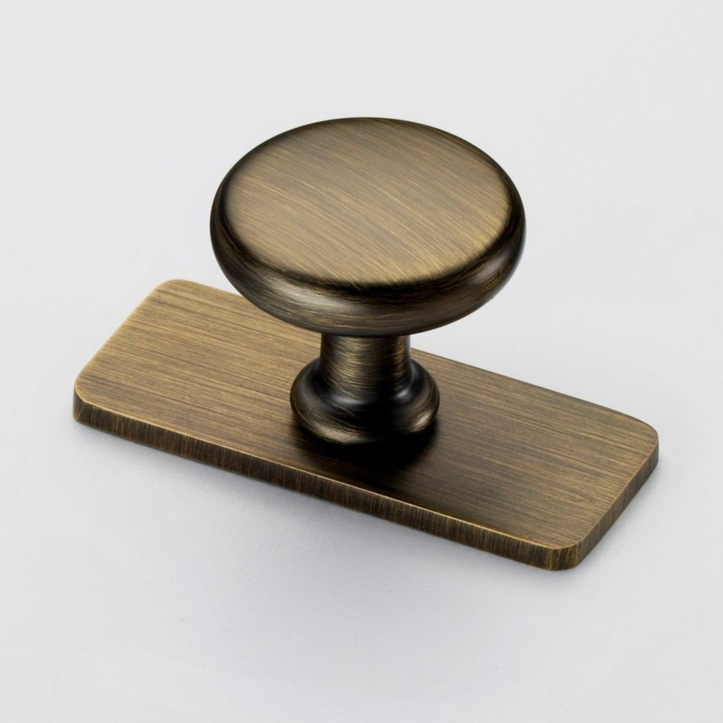 Banbury antique brass cabinet door knobs on backplate