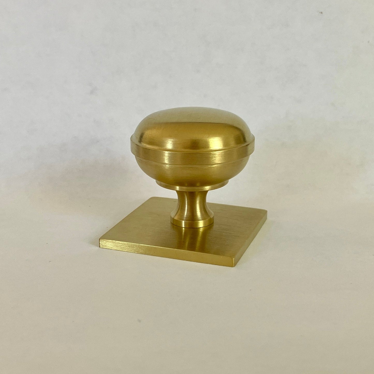 Quantock Satin Brass PVD Cupboard Knobs on Square Backplate