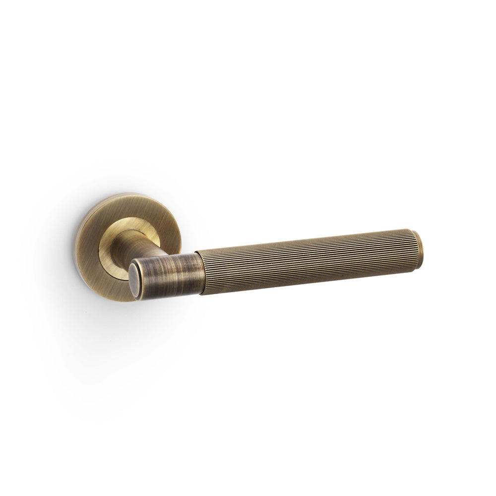 Spitfire Reeded Lever on Round Rose - Antique Brass