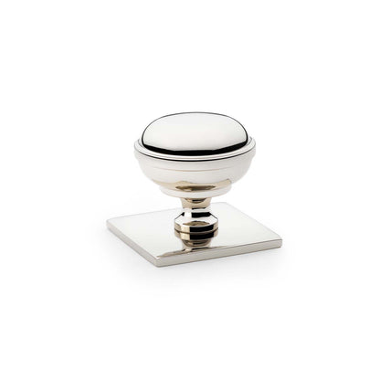 Quantock polished nickel cabinet knob on square backplate - 34mm
