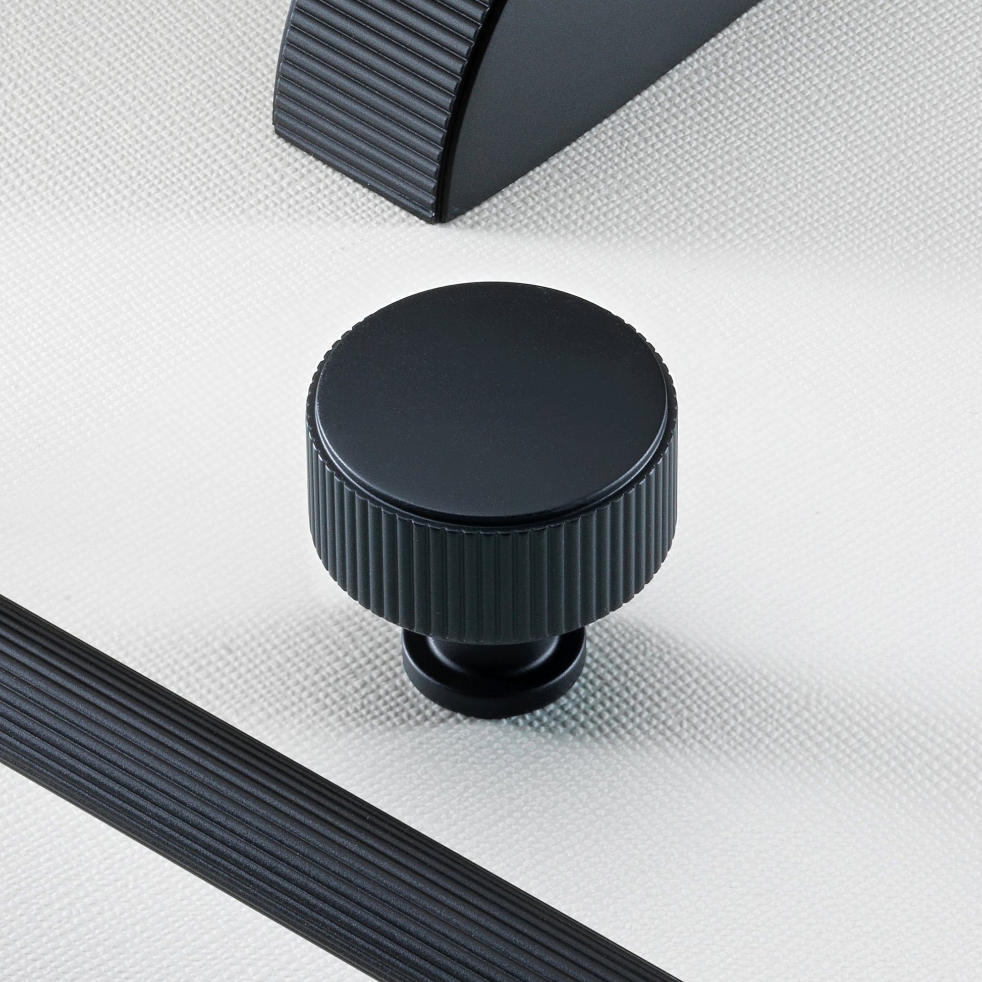 Stirling Solid Brass Reeded Cabinet Knob in Matt Black Finish