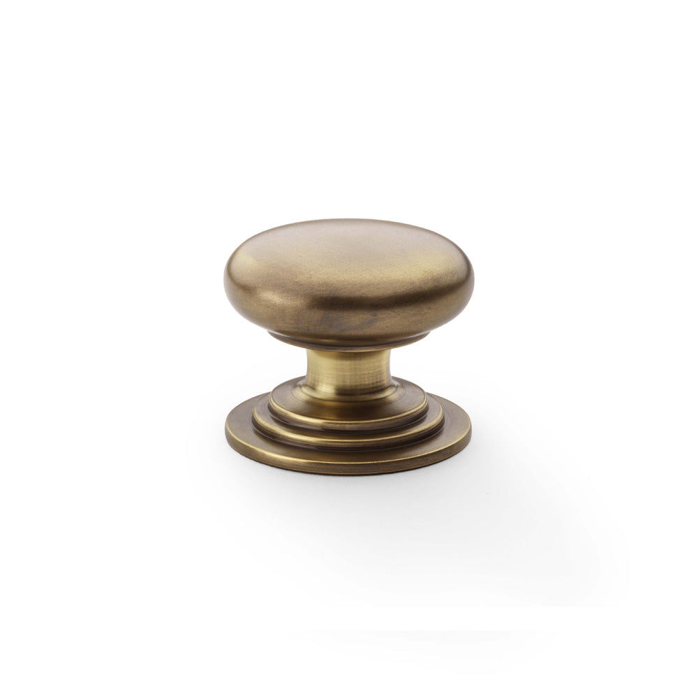 Waltz Round Cupboard Knob on Stepped Rose - Antique Brass - 38mm