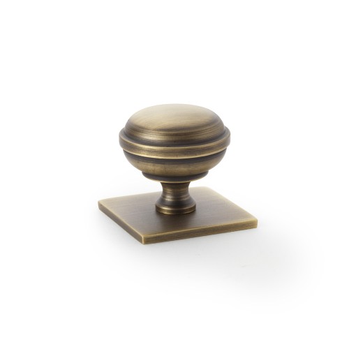 Quantock Antique Brass Cupboard Knob on Square Backplate - 34mm